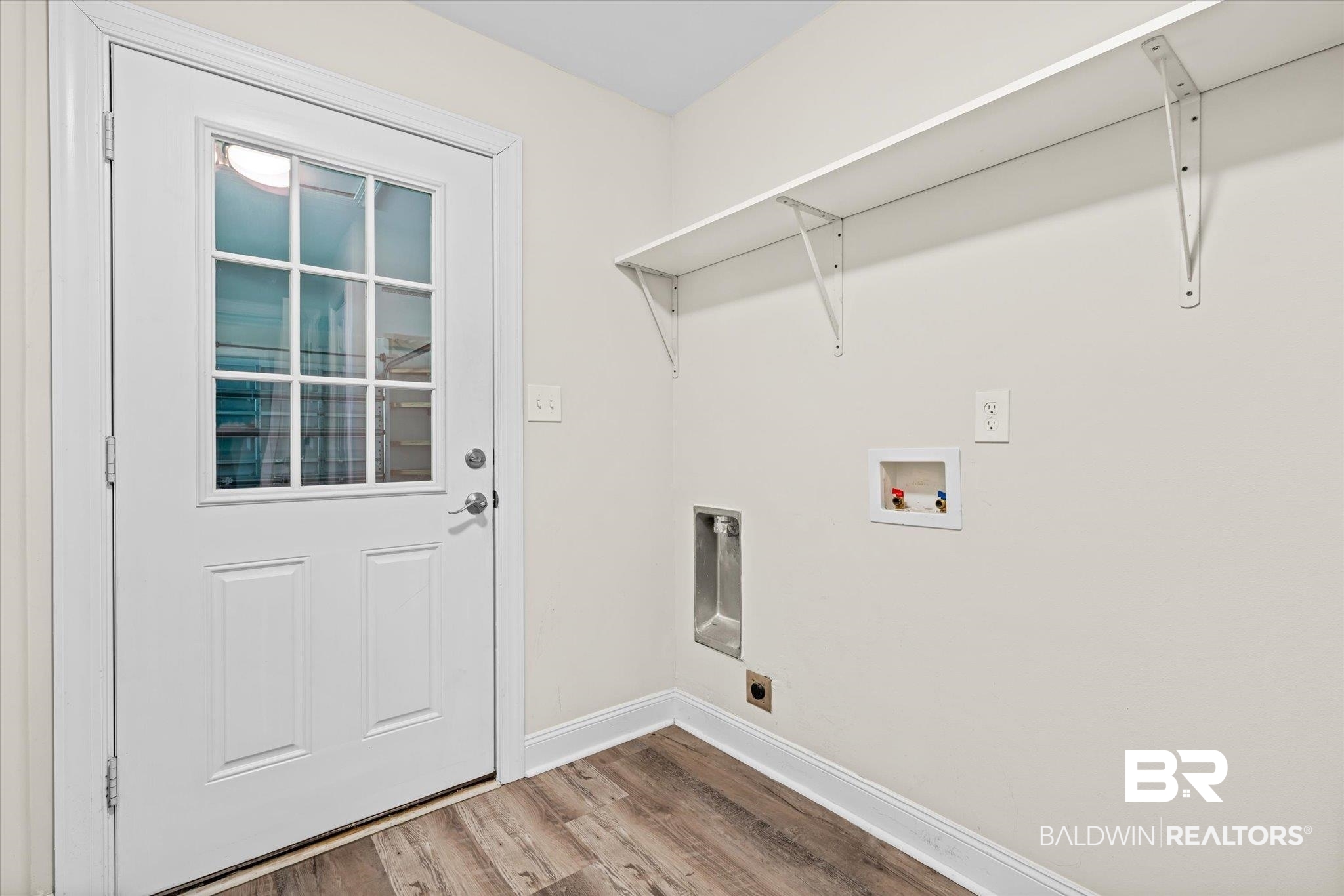 113 Pineridge Road Daphne, AL 36526 - Photo 16 of 22 Clothes washing area featuring wood-type flooring, hookup for an electric dryer, and hookup for a washing machine