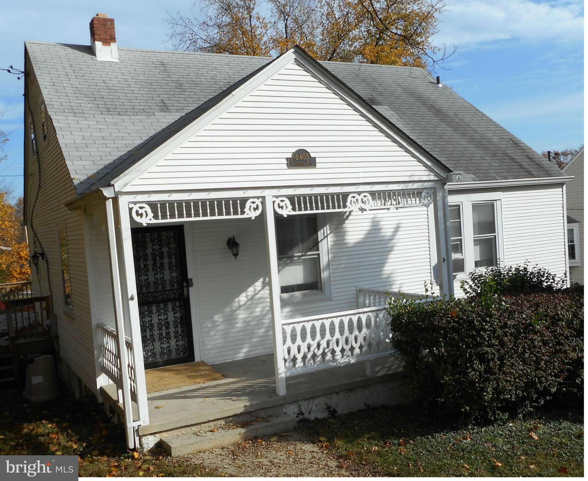 6403 Crestwood Road Baltimore, MD 21239 - Photo 1 of 15 a front view of a house with a porch