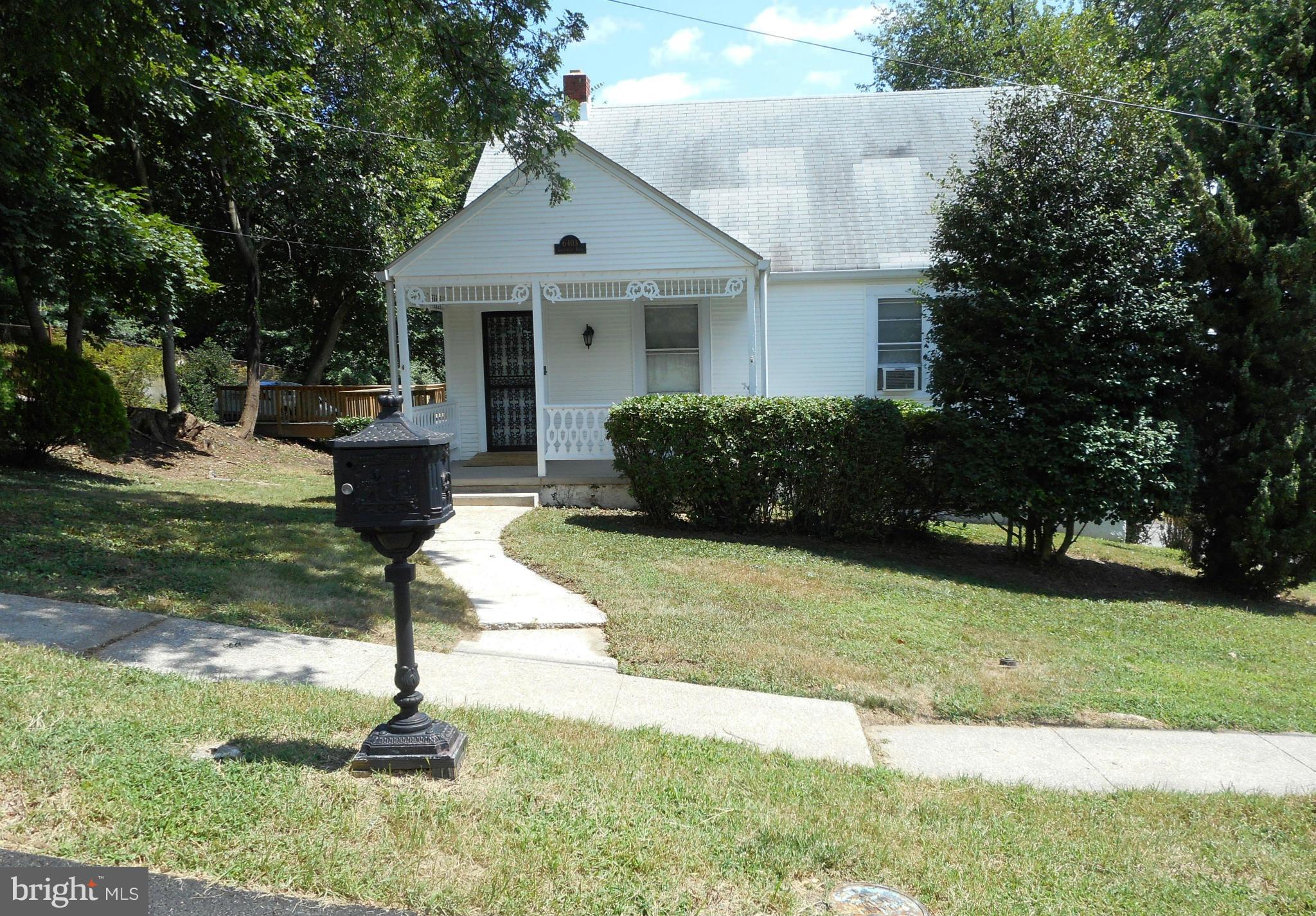 6403 Crestwood Road Baltimore, MD 21239 - Photo 2 of 15 a house view with a garden space
