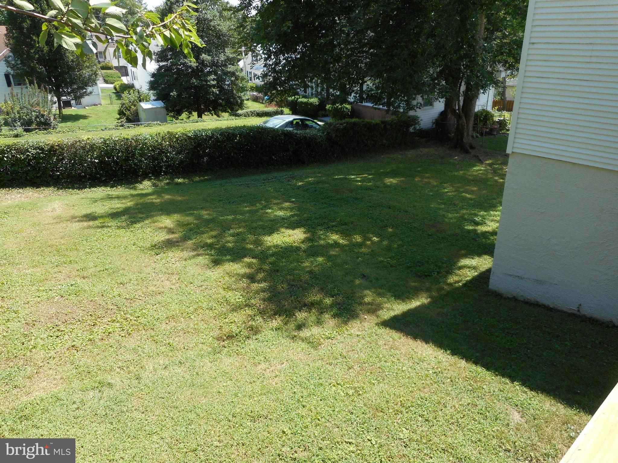 6403 Crestwood Road Baltimore, MD 21239 - Photo 12 of 15 a view of a green yard