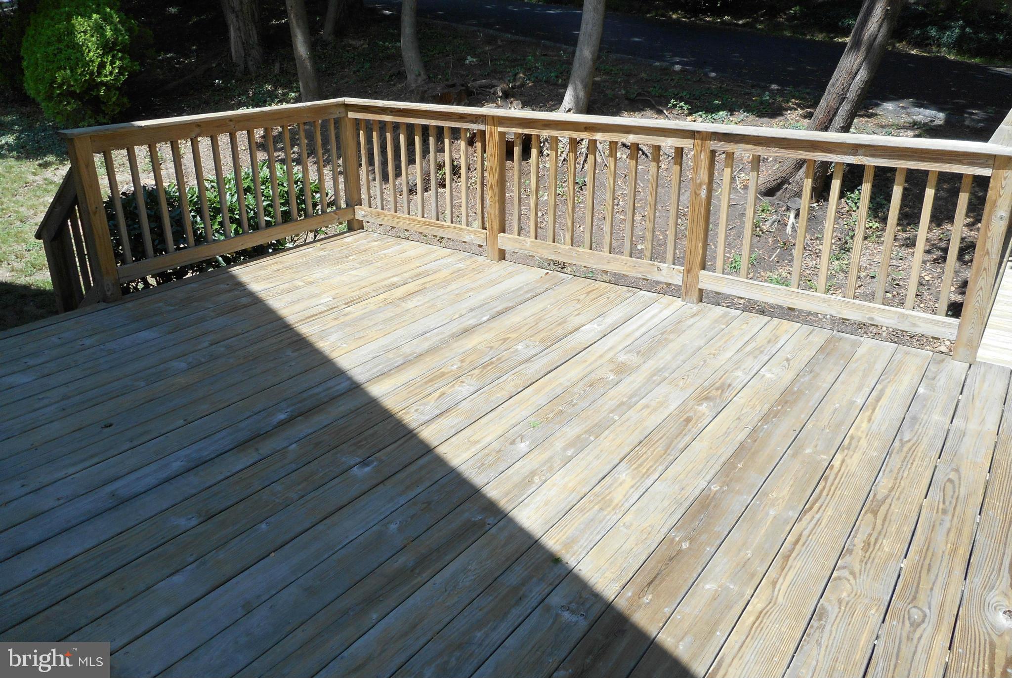6403 Crestwood Road Baltimore, MD 21239 - Photo 14 of 15 a balcony with wooden floor