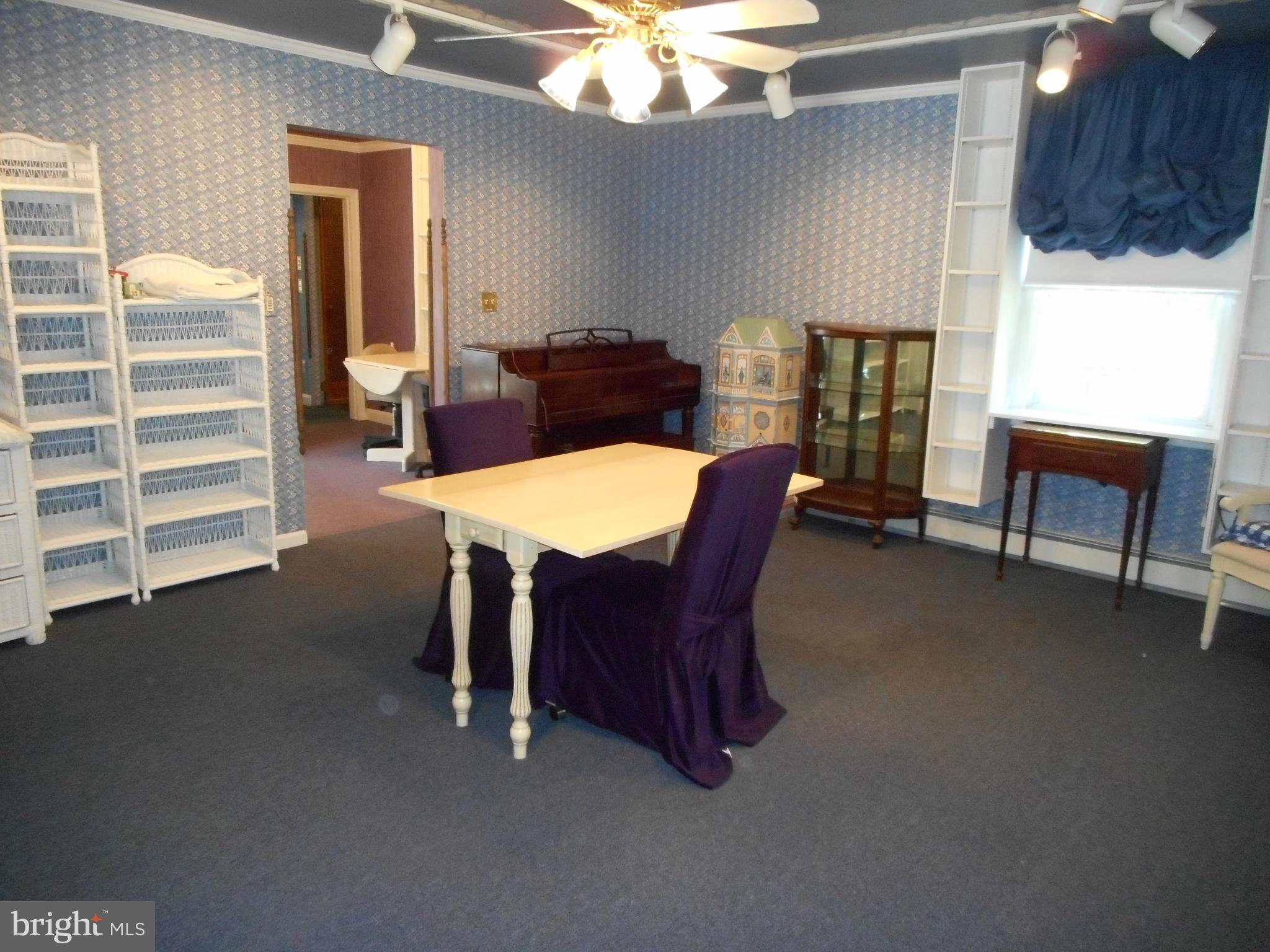 6403 Crestwood Road Baltimore, MD 21239 - Photo 7 of 15 a dining room with furniture and window