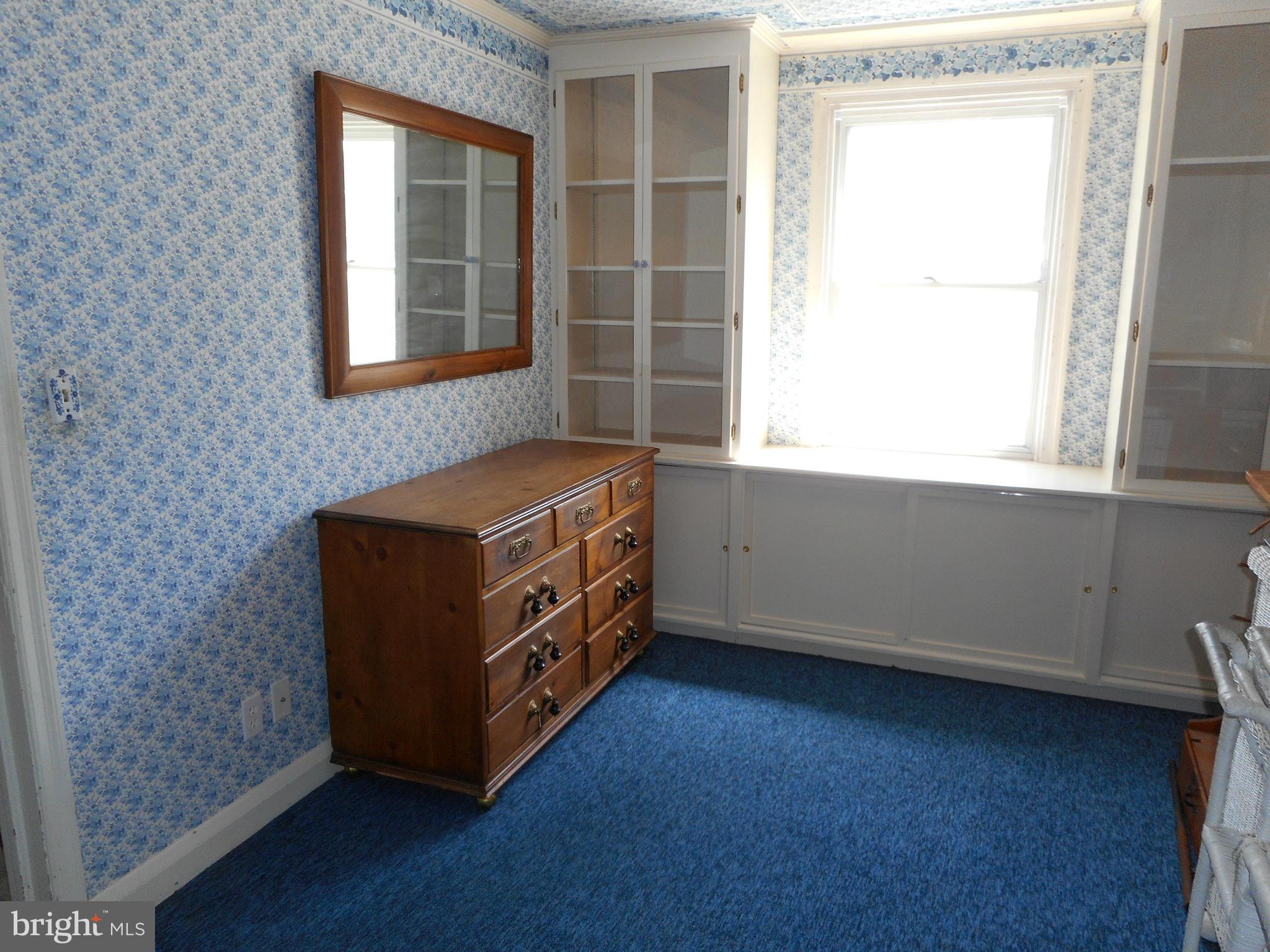 6403 Crestwood Road Baltimore, MD 21239 - Photo 9 of 15 a view of an empty room with a window