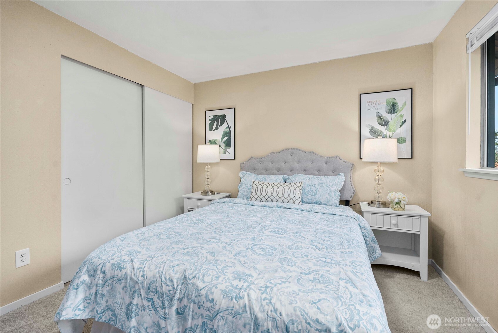 10316 Northeast 202nd Street Bothell, WA 98011 - Photo 20 of 40 a bedroom with a bed and a wall painting