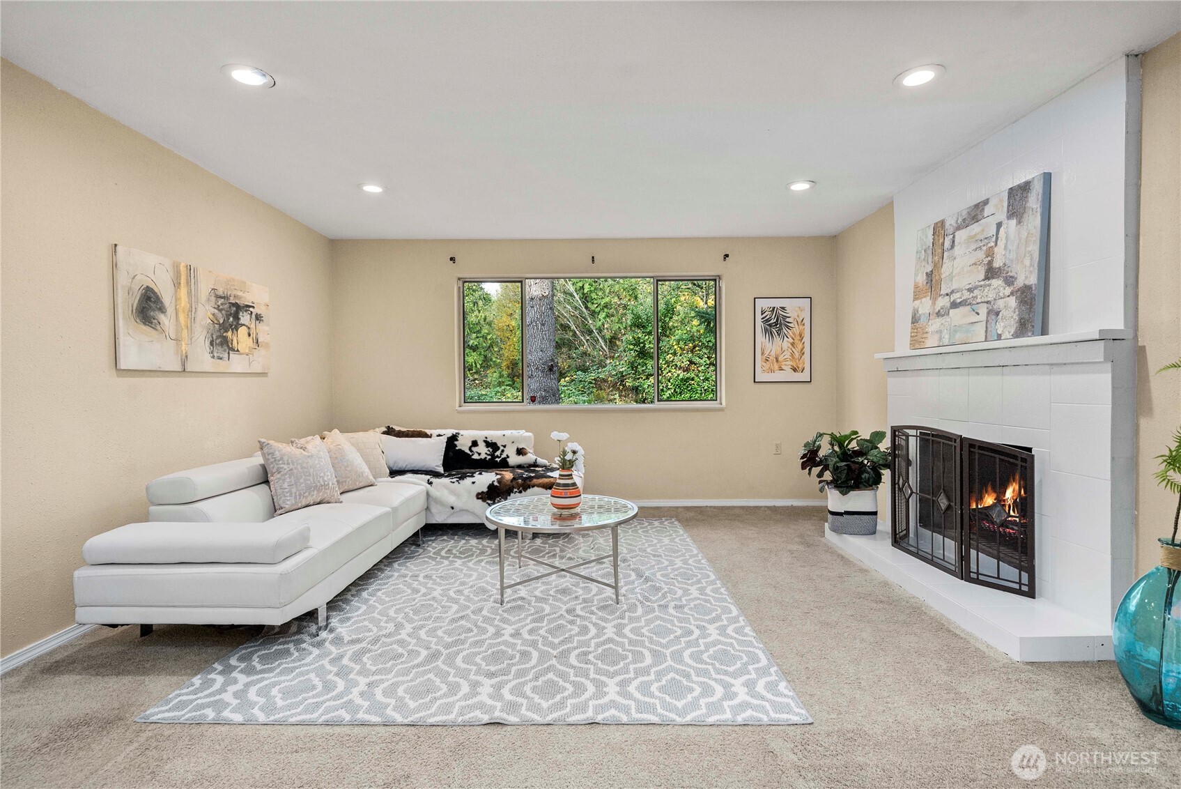 10316 Northeast 202nd Street Bothell, WA 98011 - Photo 23 of 40 a living room with furniture and a fireplace