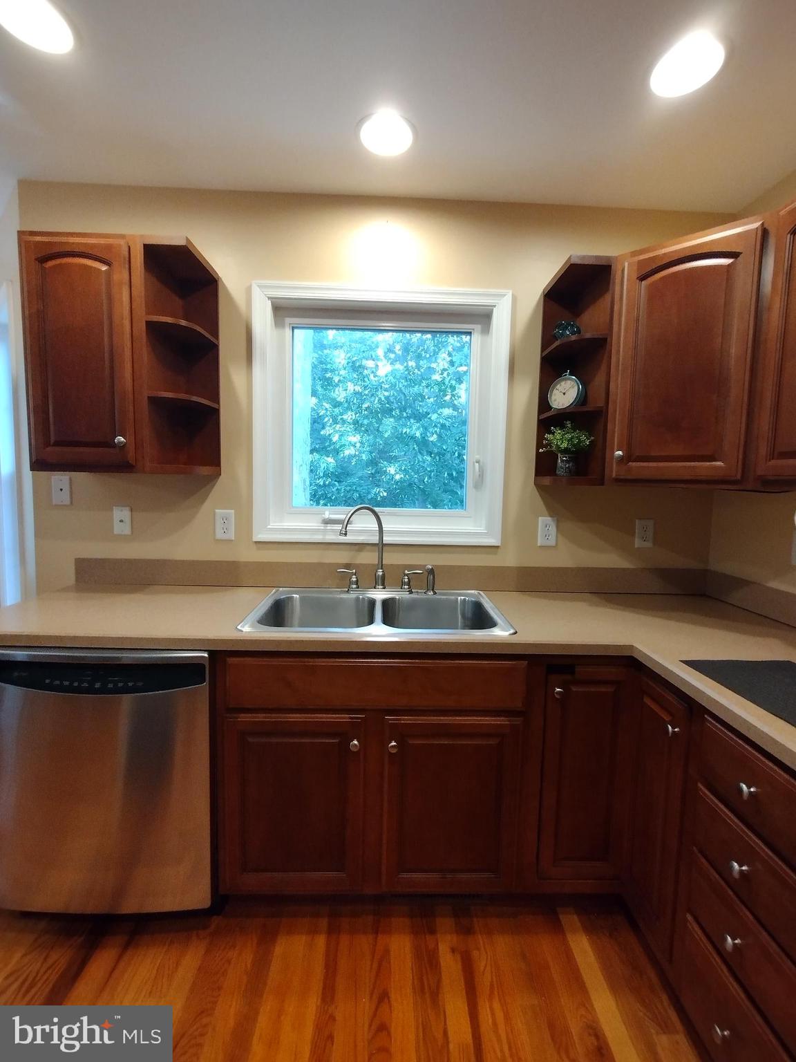 177 Raft Court Inwood, WV 25428 - Photo 13 of 40 a kitchen with a sink window and cabinets