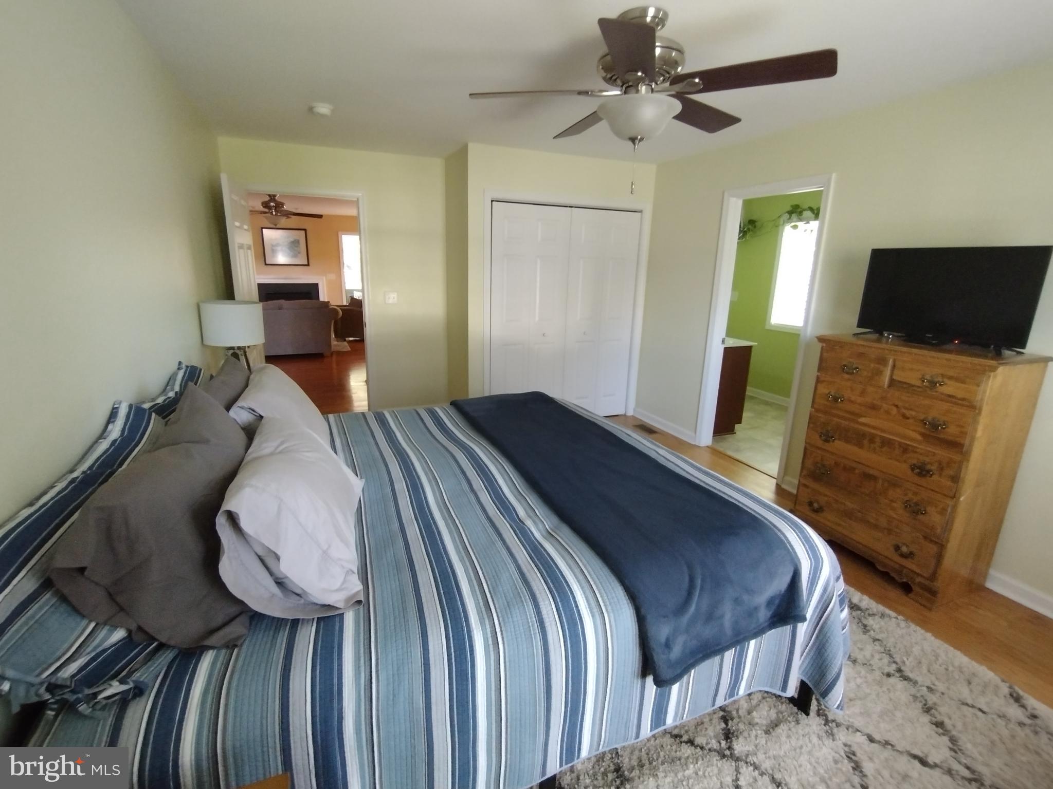 177 Raft Court Inwood, WV 25428 - Photo 26 of 40 a bedroom with a bed and wooden floor