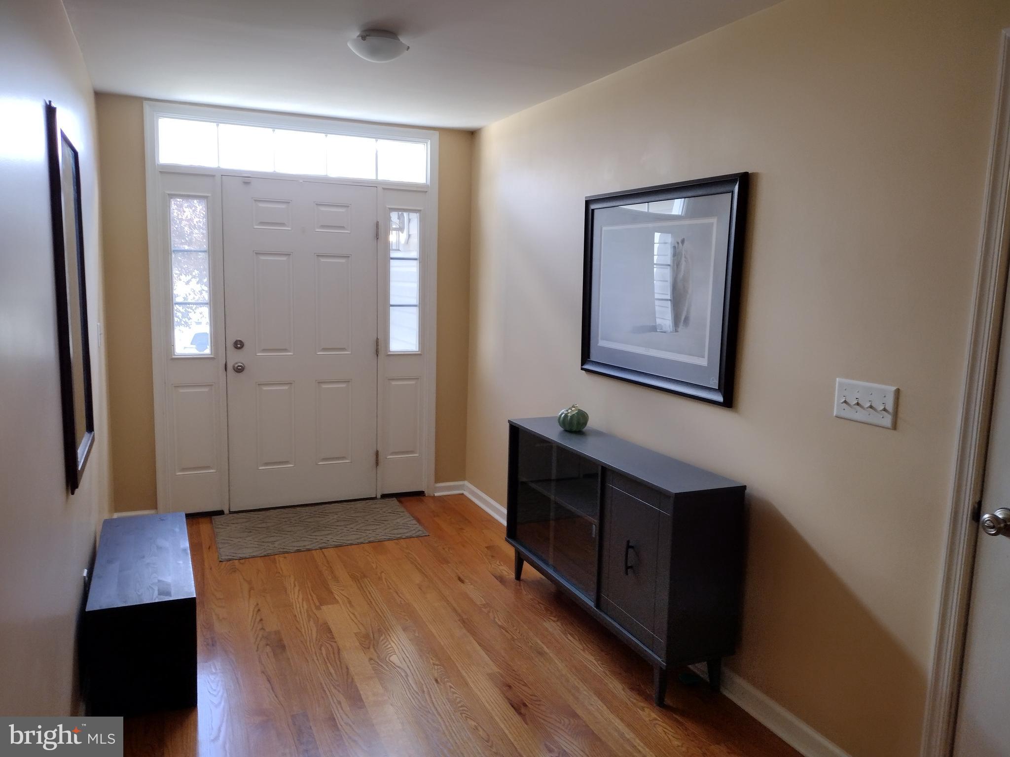 177 Raft Court Inwood, WV 25428 - Photo 4 of 40 a view of hallway with wooden floor and cabinet