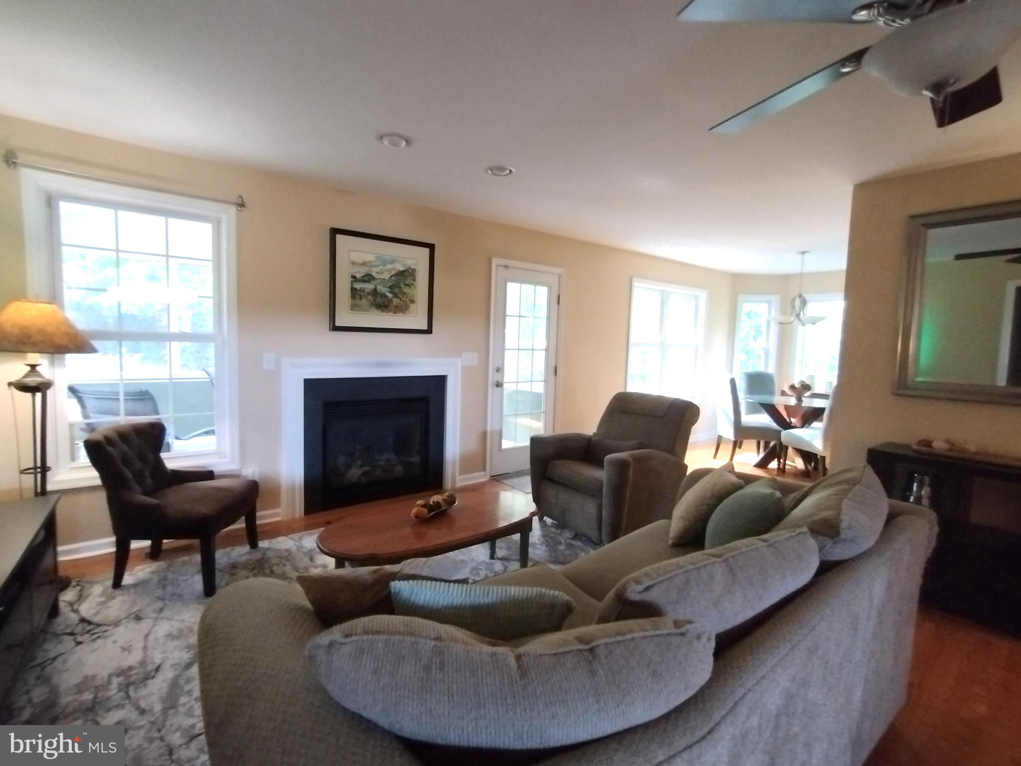 177 Raft Court Inwood, WV 25428 - Photo 6 of 40 a living room with furniture and a fireplace