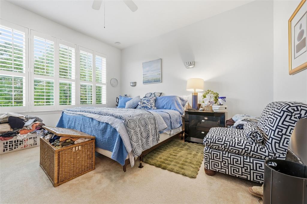 3461 Fallbrook Drive Kissimmee, FL 34759 - Photo 17 of 43 a bedroom with bed couch and window