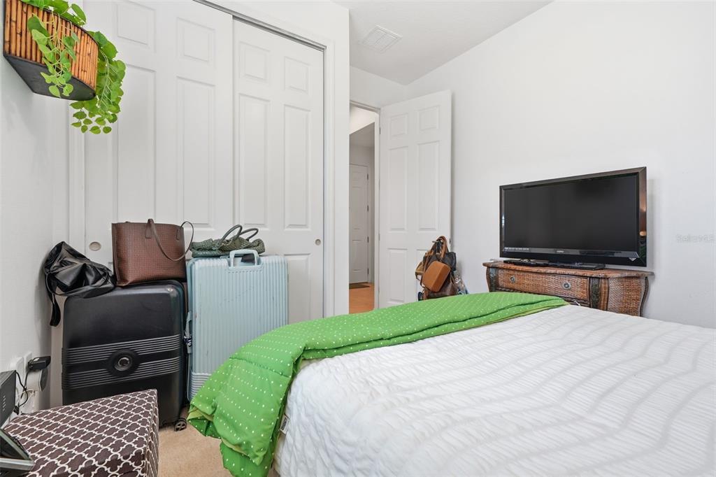 3461 Fallbrook Drive Kissimmee, FL 34759 - Photo 21 of 43 a bedroom with a bed and a television