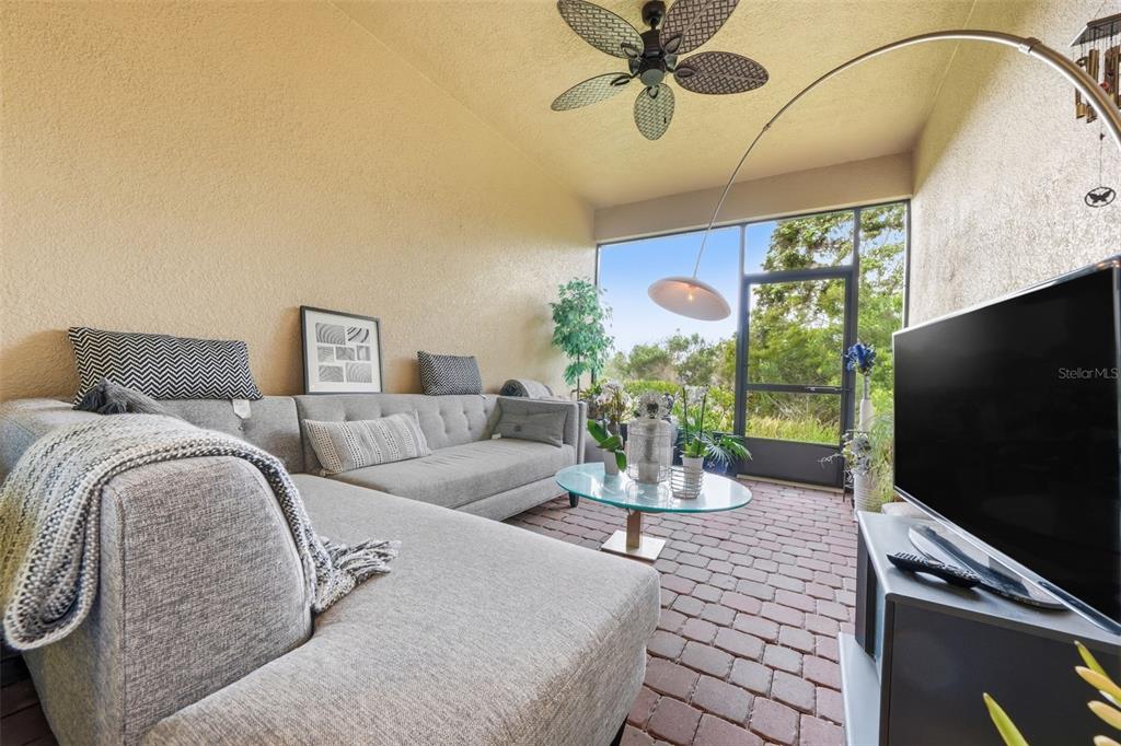 3461 Fallbrook Drive Kissimmee, FL 34759 - Photo 25 of 43 a living room with furniture and a flat screen tv