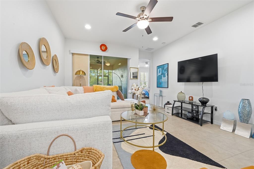 3461 Fallbrook Drive Kissimmee, FL 34759 - Photo 7 of 43 a living room with furniture and a flat screen tv