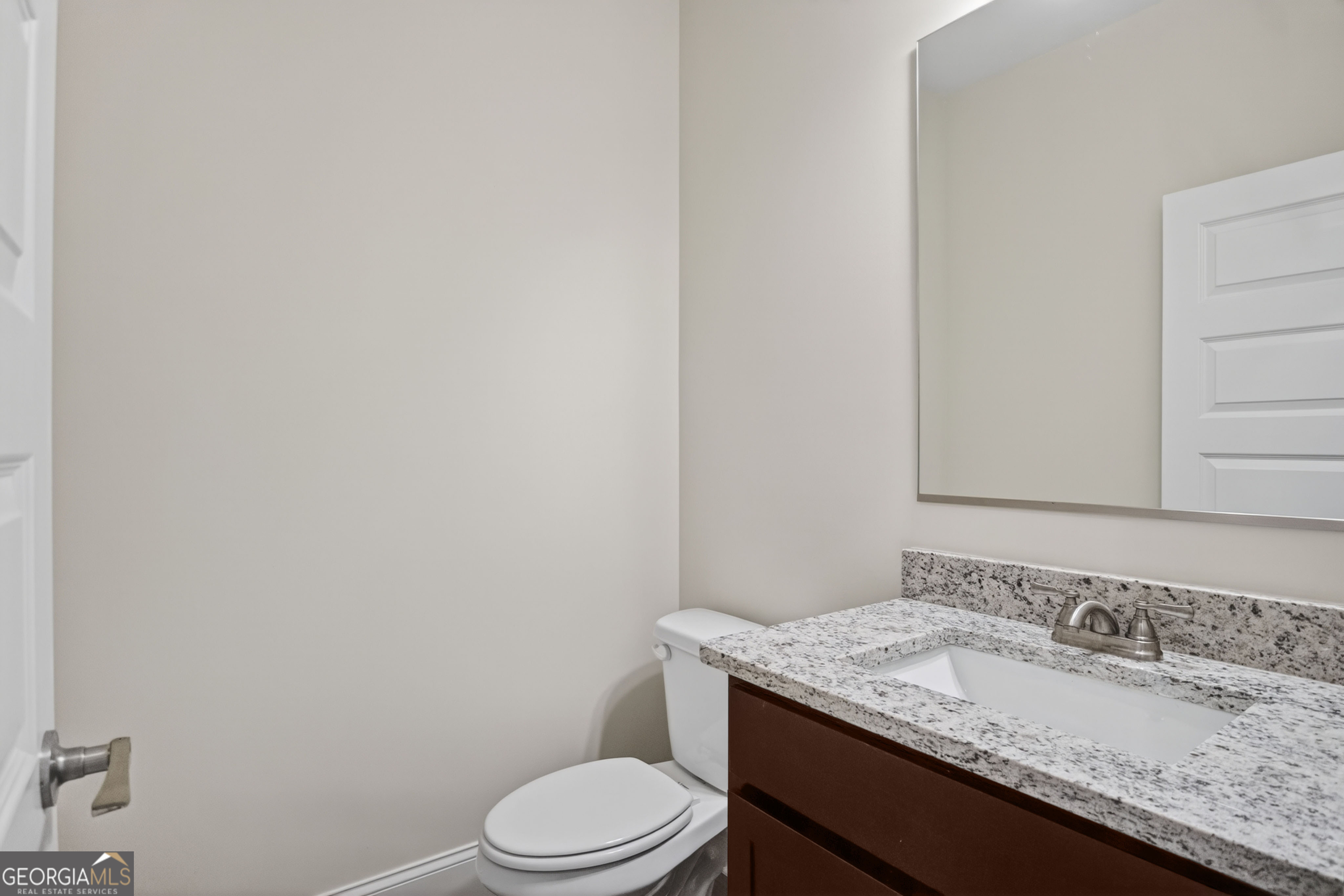 1350-c O Draper Road Comer, GA 30629 - Photo 19 of 47 a bathroom with a granite countertop sink toilet and mirror