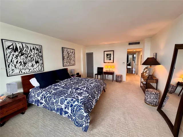 a bedroom with bed and window