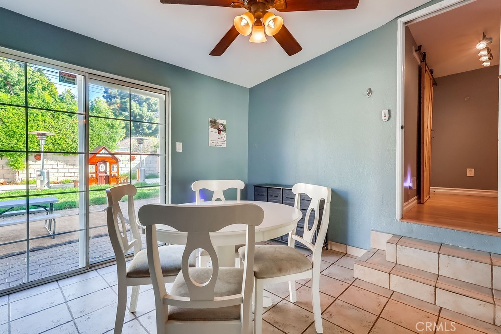 5202 Fidler Avenue Lakewood, CA 90712 - Photo 12 of 30 a view of a dining room with furniture window and outside view