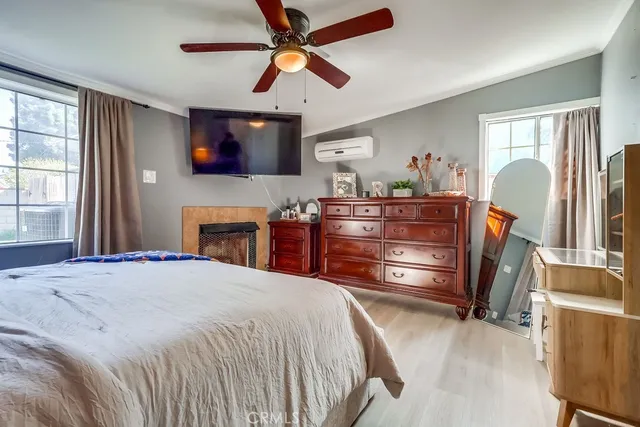 a bed room with a bed and a television