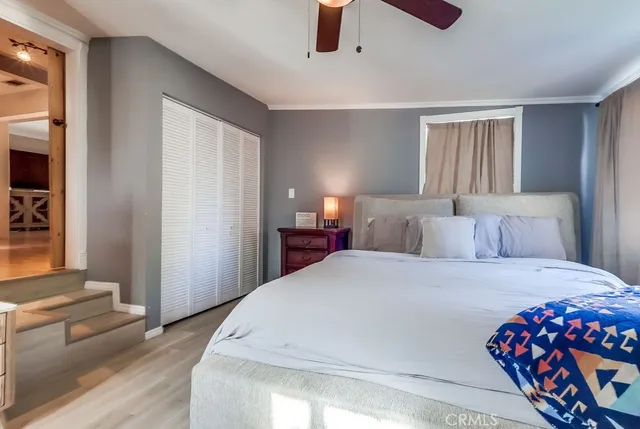 a bedroom with a bed and a dresser