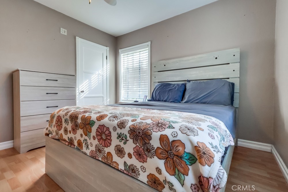 5202 Fidler Avenue Lakewood, CA 90712 - Photo 19 of 30 a bedroom with a large bed and a window