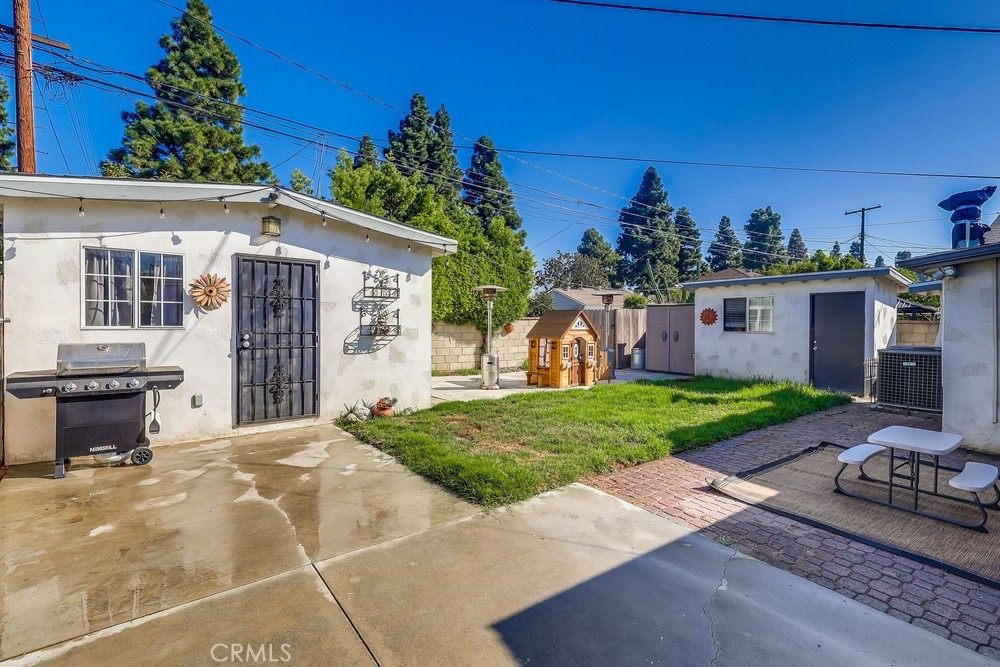 5202 Fidler Avenue Lakewood, CA 90712 - Photo 23 of 30 a front view of a house with garden
