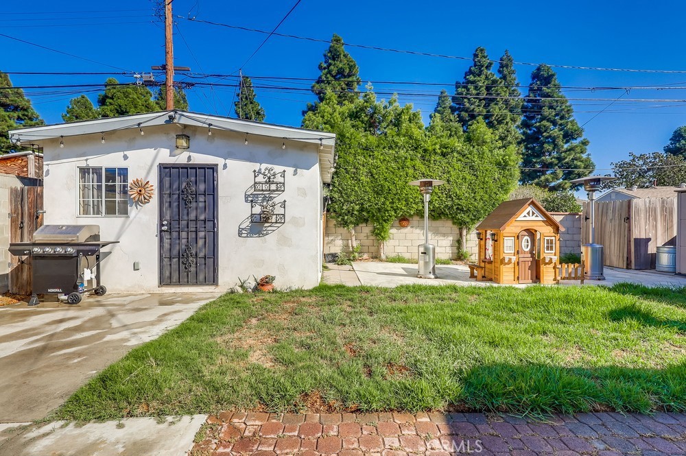 5202 Fidler Avenue Lakewood, CA 90712 - Photo 25 of 30 a front view of a house with a yard