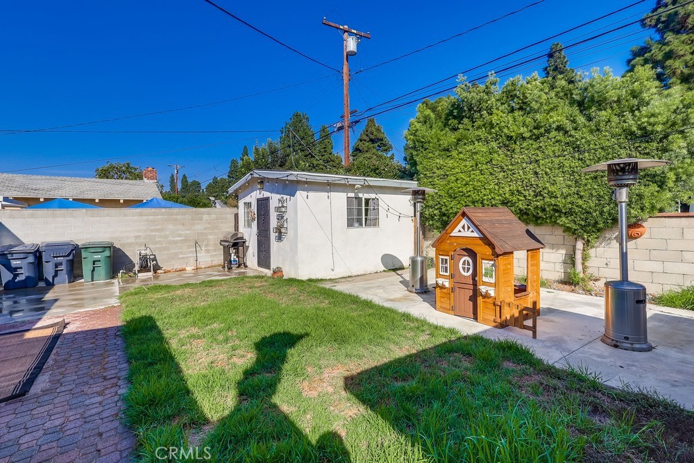5202 Fidler Avenue Lakewood, CA 90712 - Photo 26 of 30 a front view of a house with garden