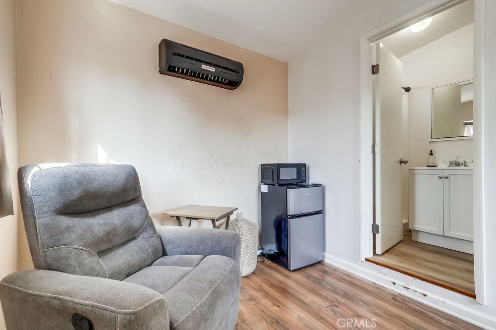 5202 Fidler Avenue Lakewood, CA 90712 - Photo 27 of 30 a living room with furniture and a rug