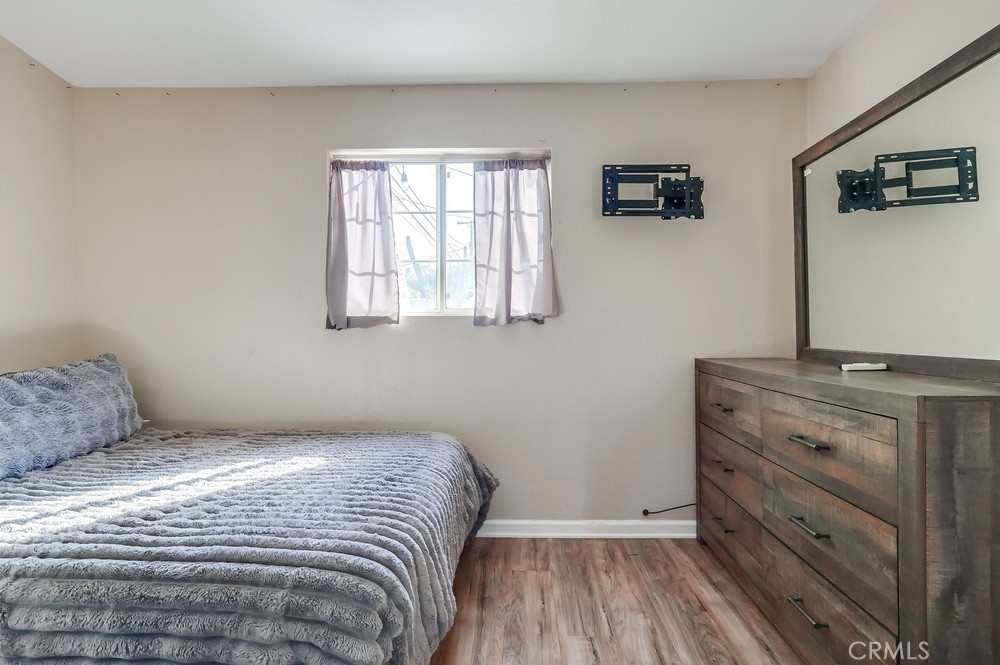 5202 Fidler Avenue Lakewood, CA 90712 - Photo 29 of 30 a bedroom with a bed and a window