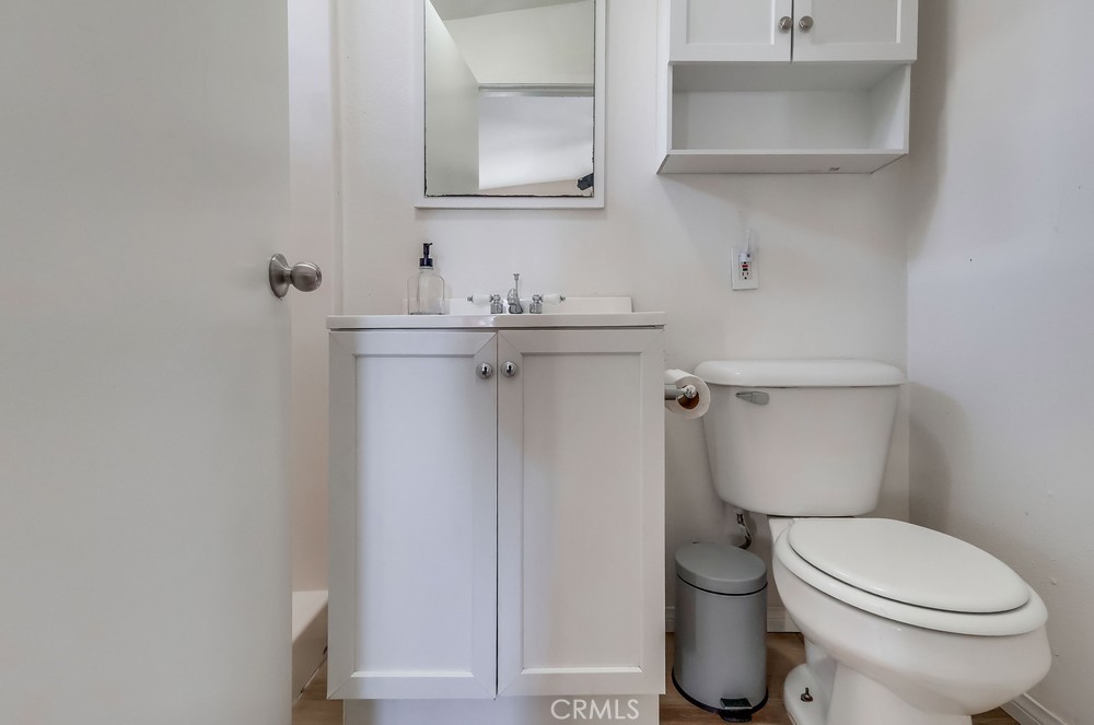 5202 Fidler Avenue Lakewood, CA 90712 - Photo 30 of 30 a white toilet sitting next to a bathroom sink