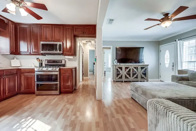 a living room with furniture and a flat screen tv