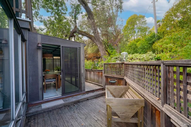 a view of balcony with furniture and garden