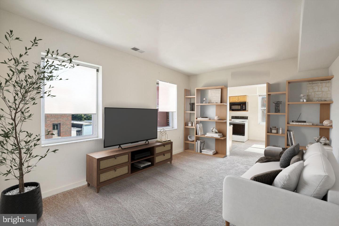 a living room with furniture and a flat screen tv
