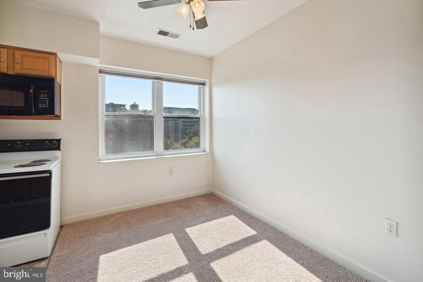 55 M Street Northwest, Unit 406 Washington, DC 20001 - Photo 12 of 23 a big room with windows and fireplace