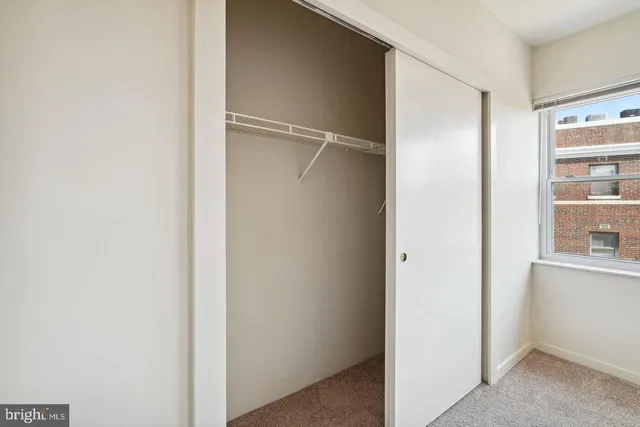 a view of cabinets and closet