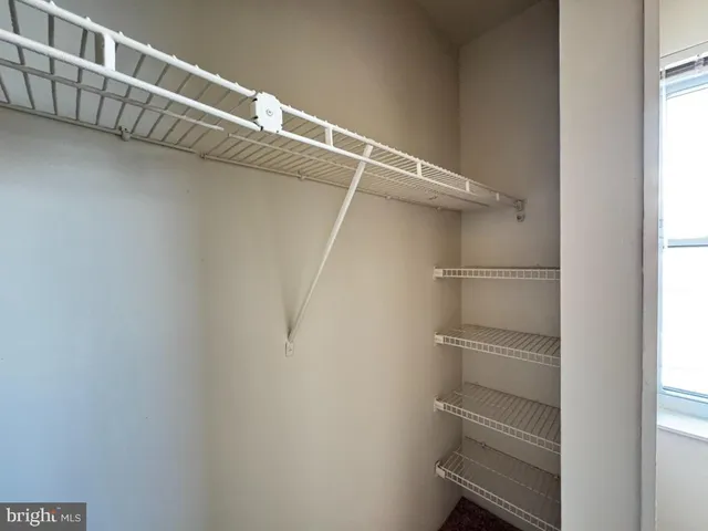 a view of an empty walk in closet