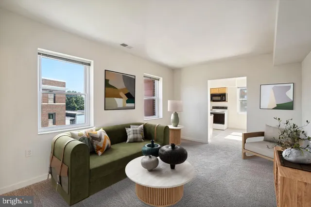 a living room with furniture and a large window