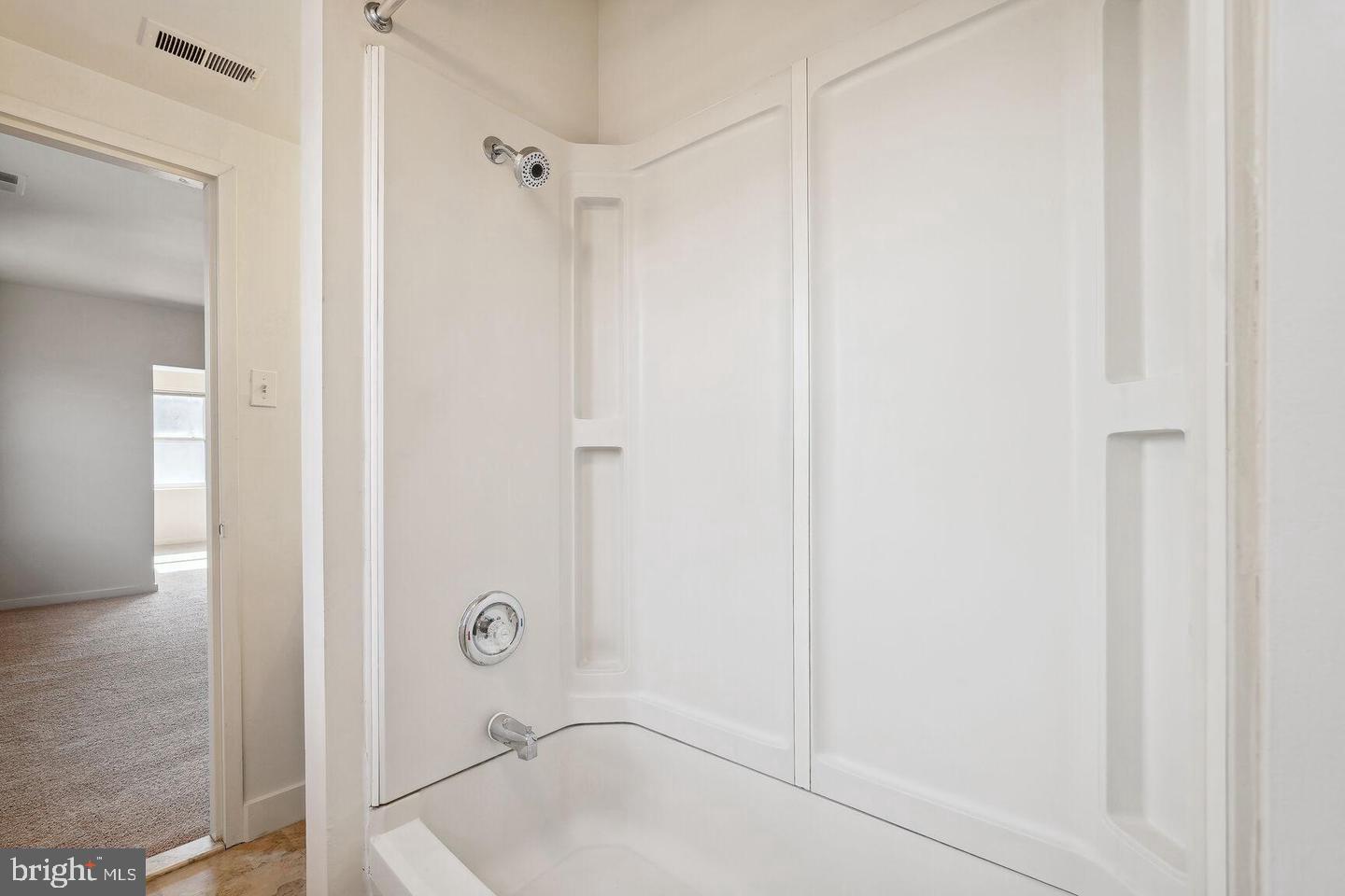 55 M Street Northwest, Unit 406 Washington, DC 20001 - Photo 6 of 23 a bathroom with a glass shower door