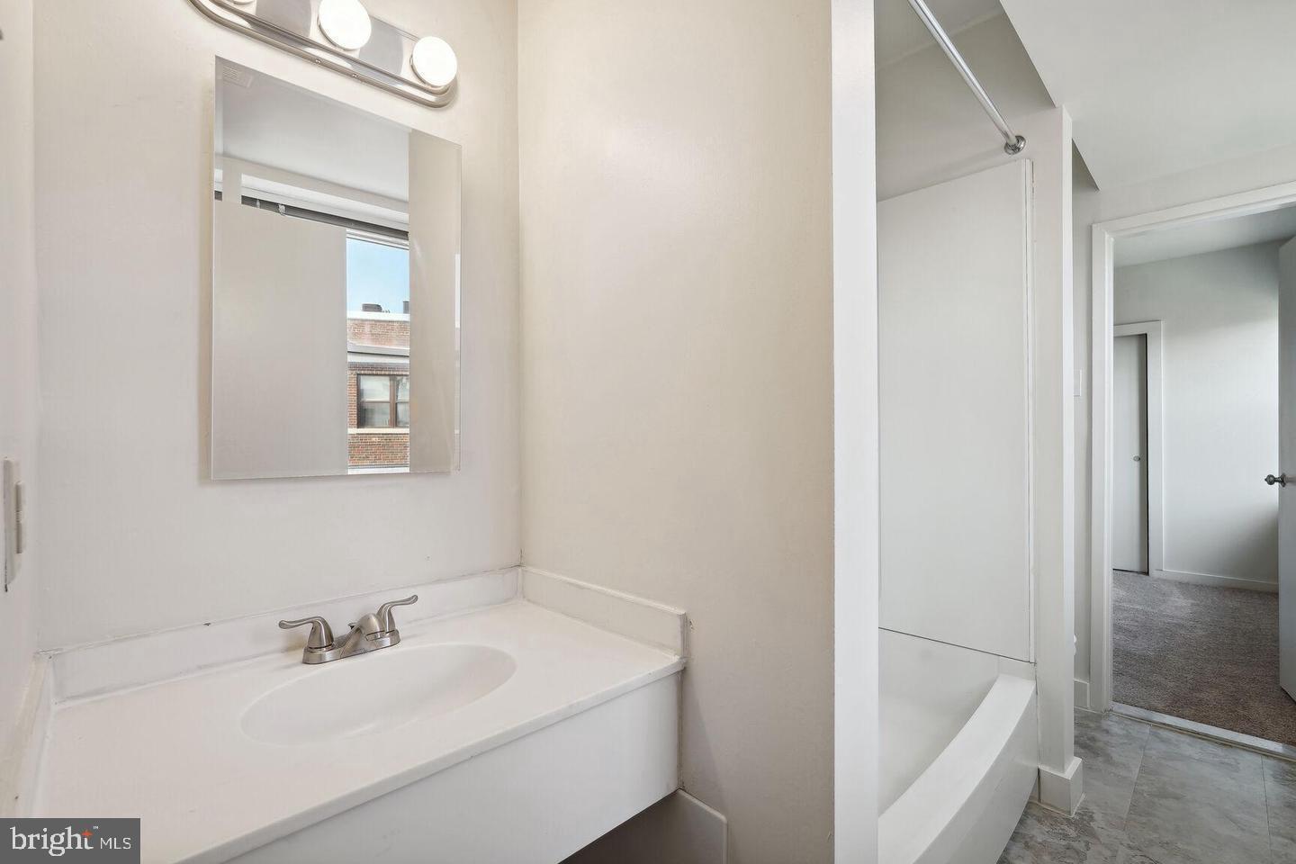 55 M Street Northwest, Unit 406 Washington, DC 20001 - Photo 7 of 23 a bathroom with a sink and a bathtub