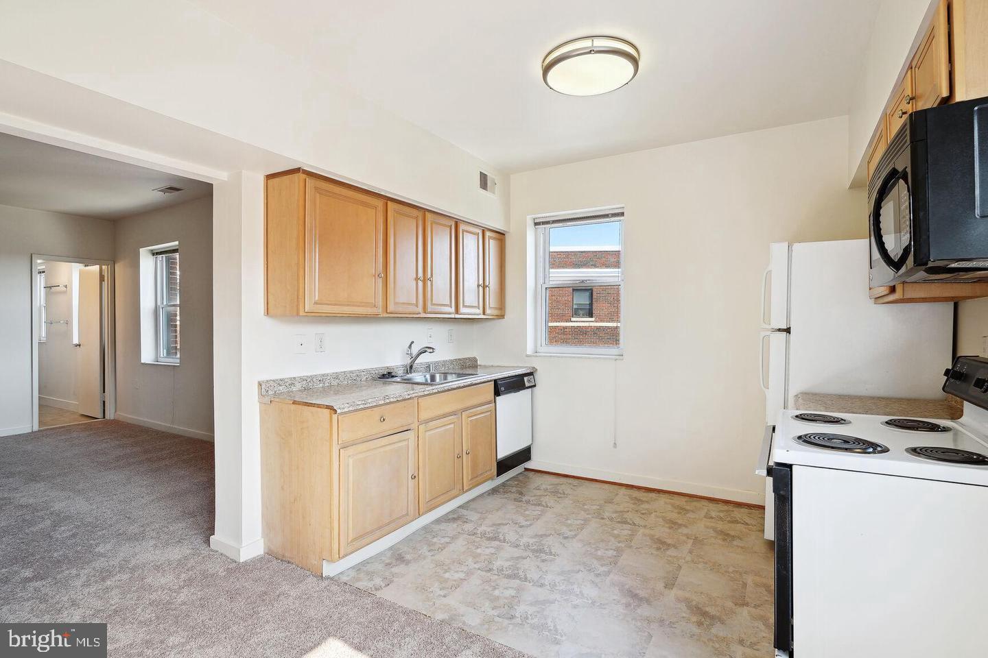 55 M Street Northwest, Unit 406 Washington, DC 20001 - Photo 8 of 23 a kitchen with stainless steel appliances granite countertop a stove and a sink