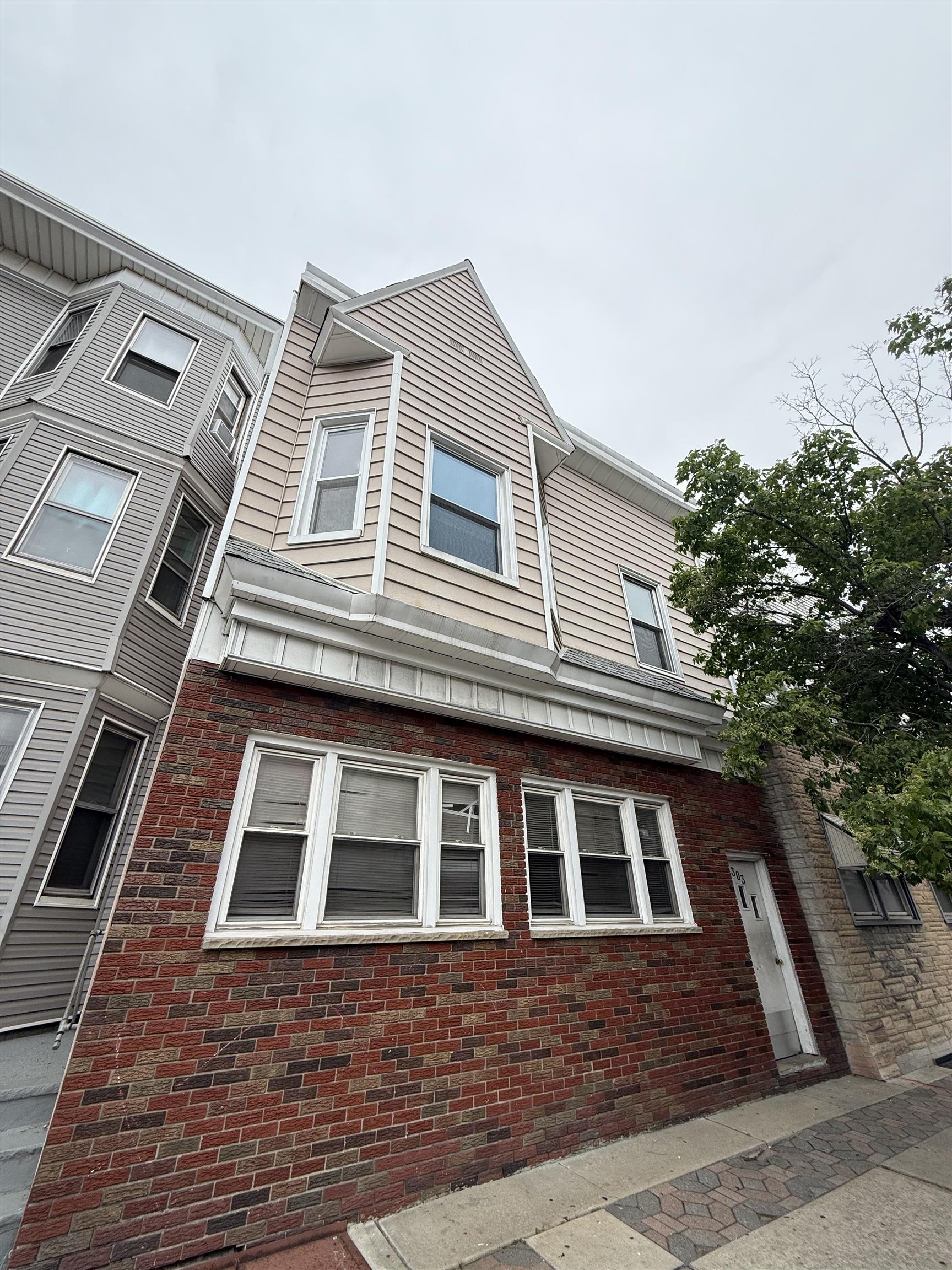 303 Broadway, Unit 1A Bayonne, NJ 07002 - Photo 6 of 6 a front view of a house