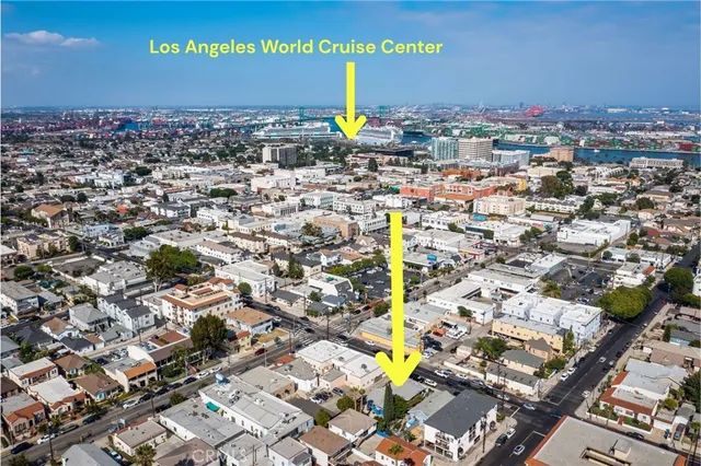 a view of a house with wooden fence and two windows