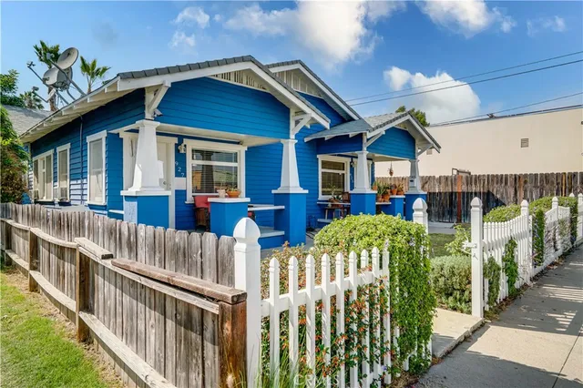 a bedroom with furniture and a flat screen tv