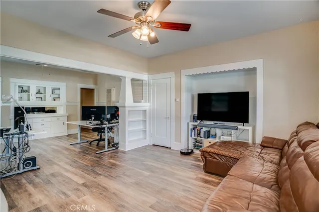 a workspace with furniture window and wooden floor