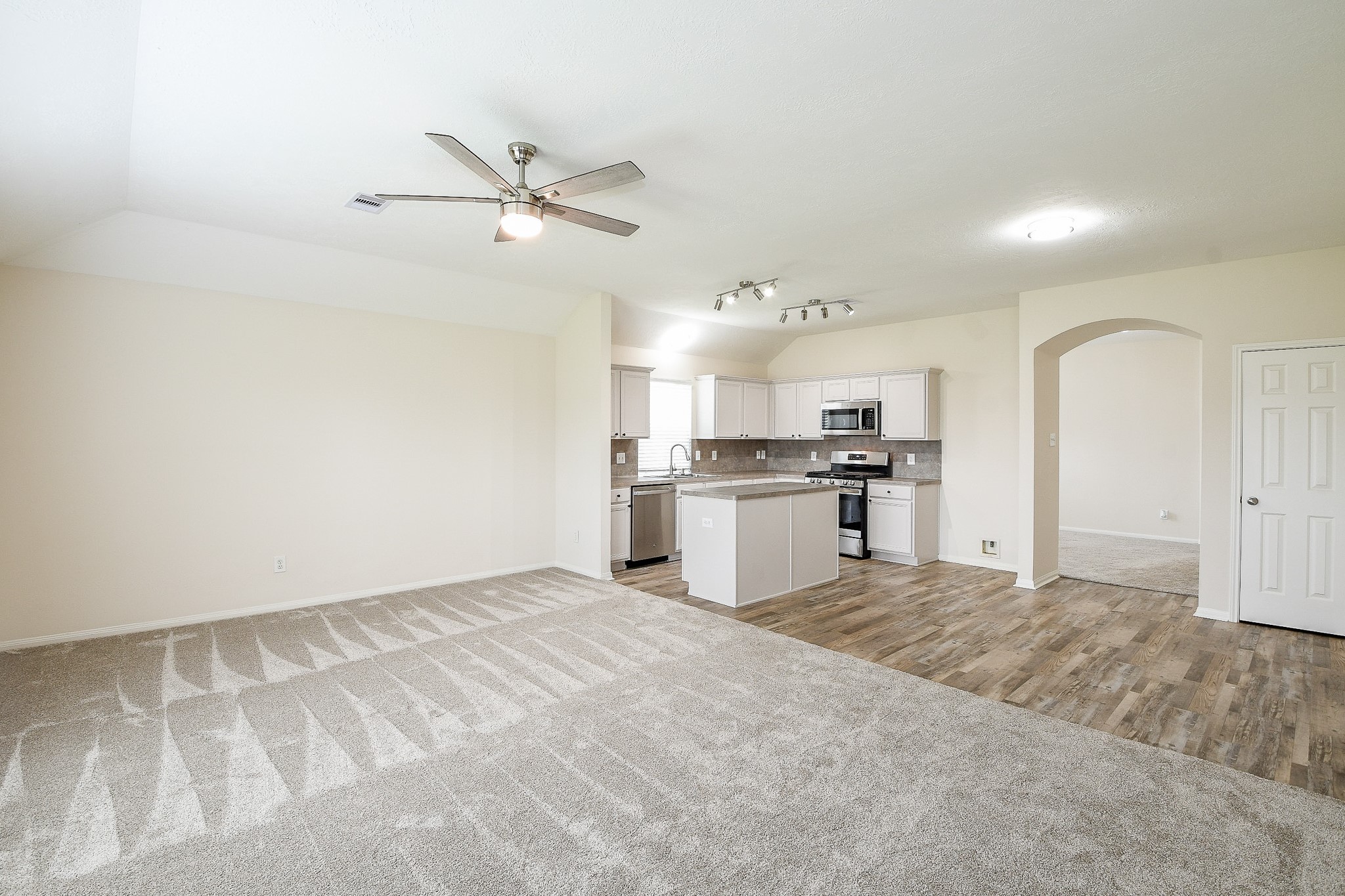 9203 Windy Spring Court Houston, TX 77089 - Photo 14 of 33 a view of kitchen with wooden floor and window