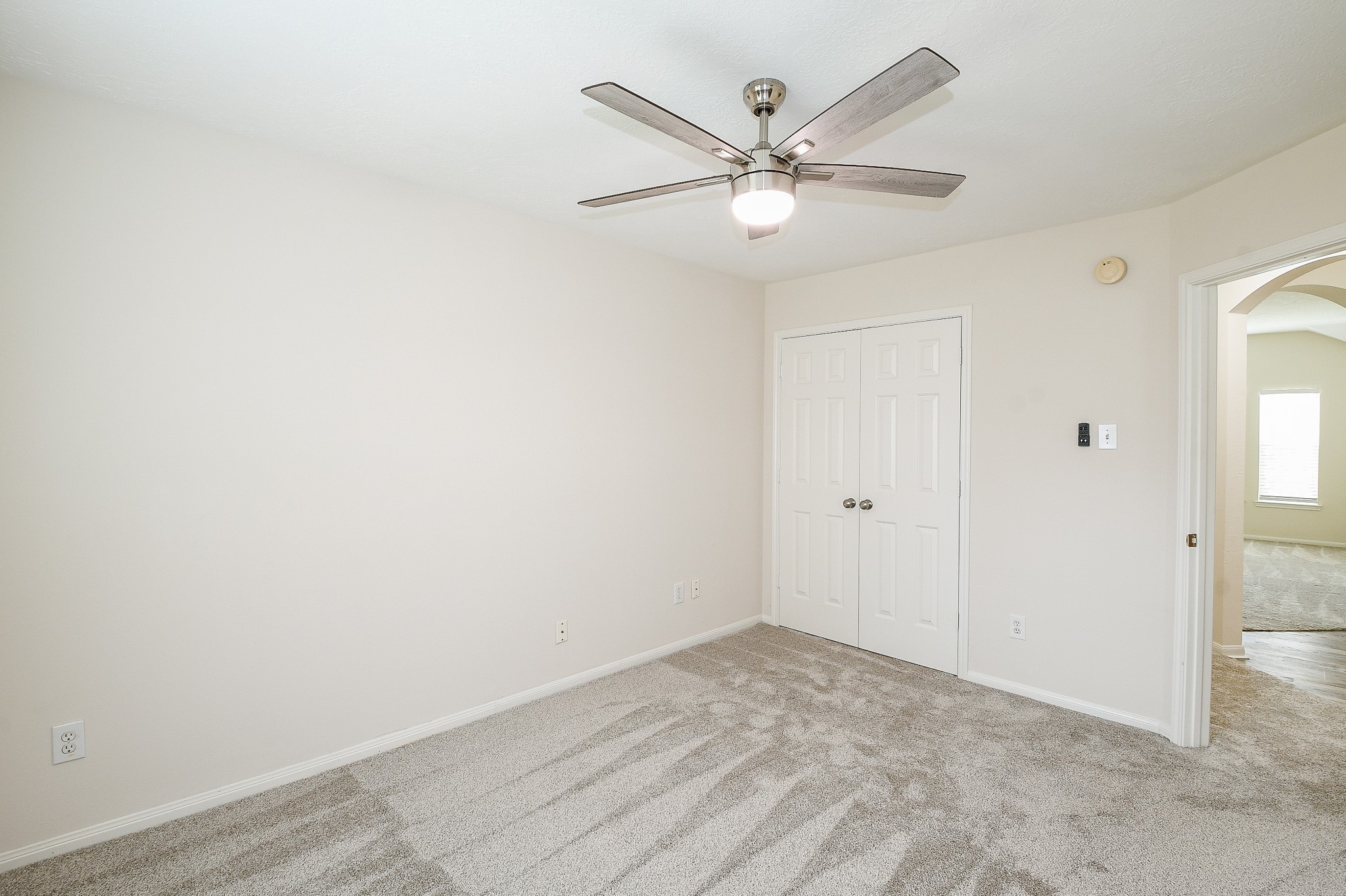 9203 Windy Spring Court Houston, TX 77089 - Photo 24 of 33 an empty room with a ceiling fan and a window