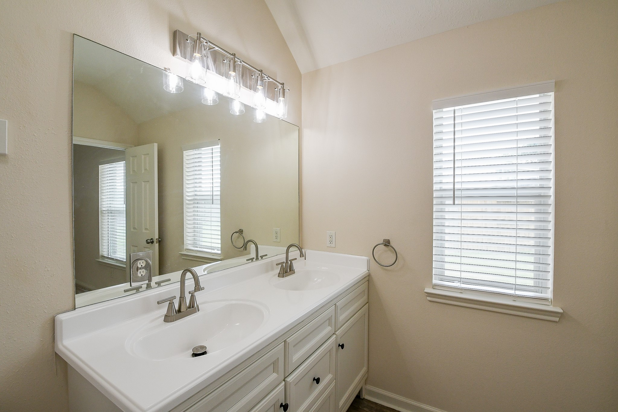 9203 Windy Spring Court Houston, TX 77089 - Photo 26 of 33 a bathroom with a sink and a mirror