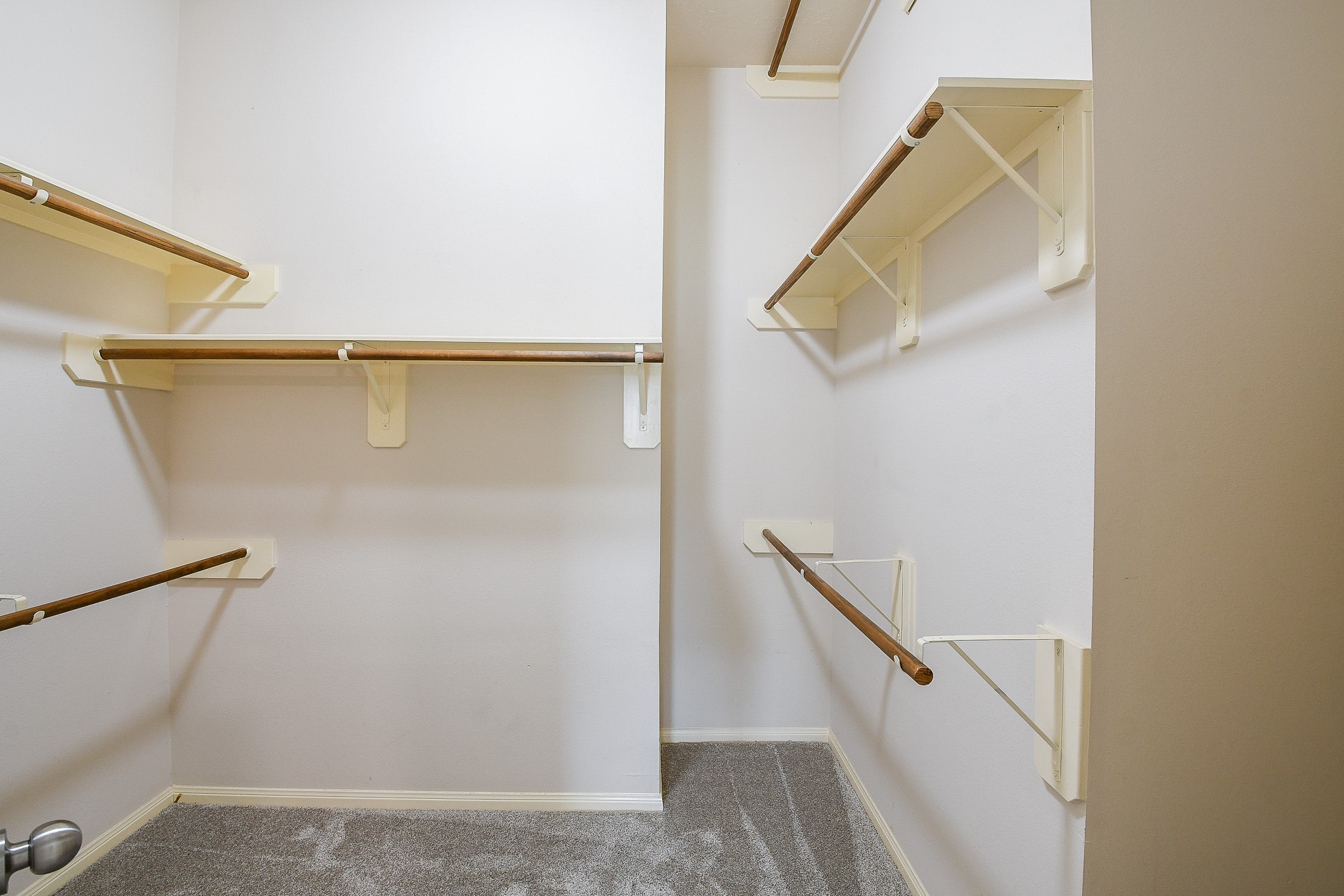 9203 Windy Spring Court Houston, TX 77089 - Photo 29 of 33 a view of staircase with white walls and railing