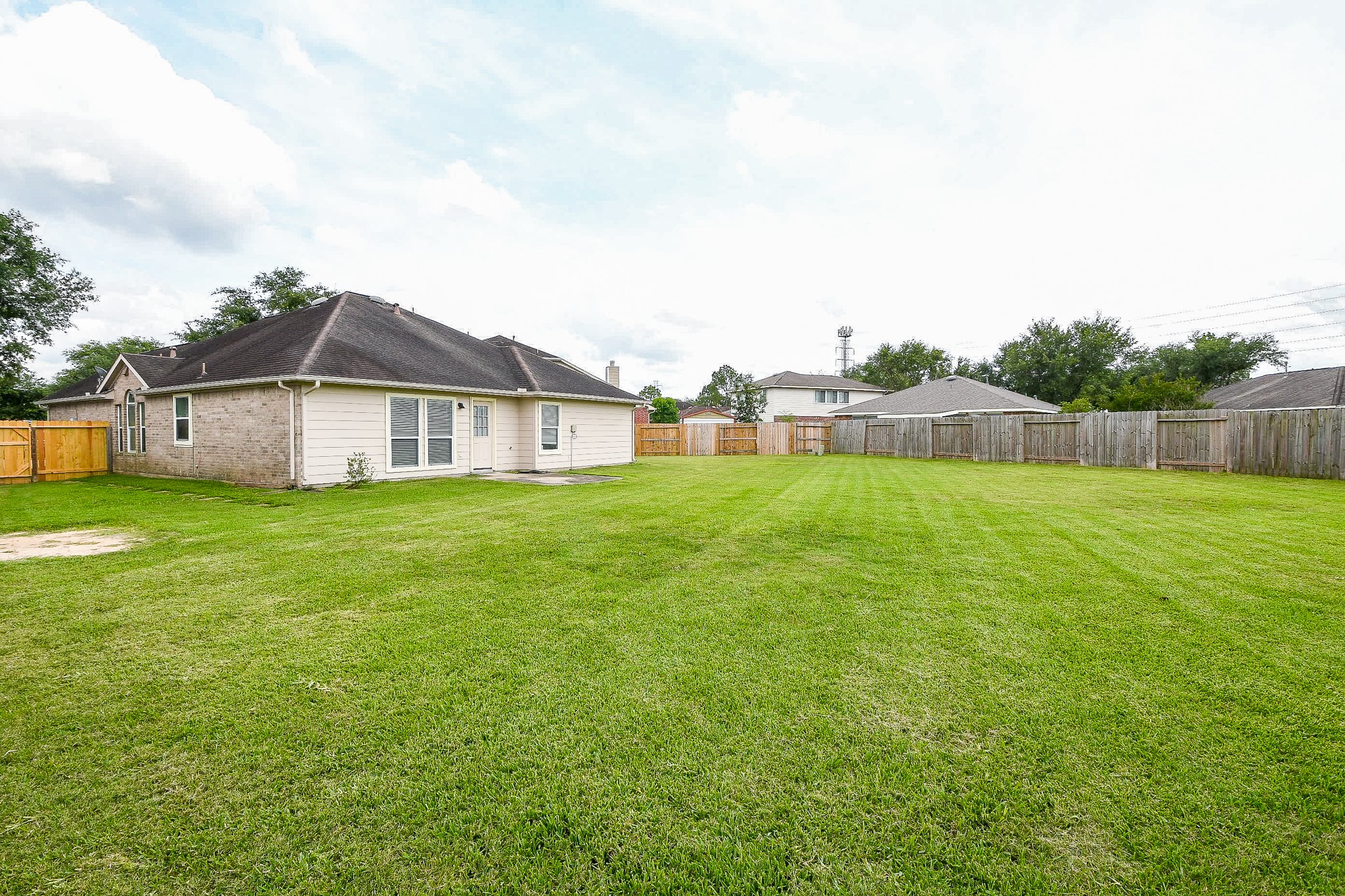 9203 Windy Spring Court Houston, TX 77089 - Photo 30 of 33 a view of a house with a yard and sitting area