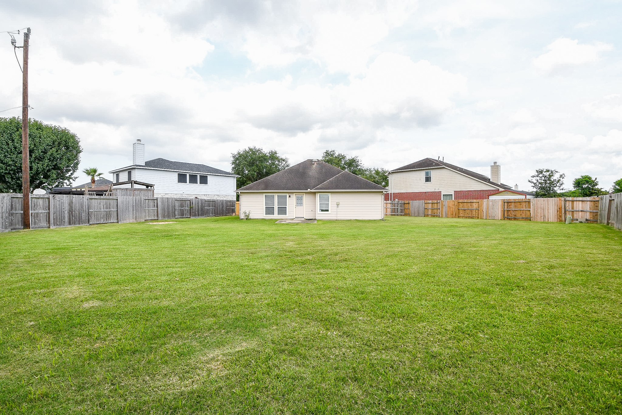 9203 Windy Spring Court Houston, TX 77089 - Photo 31 of 33 a view of a house with a yard and sitting area