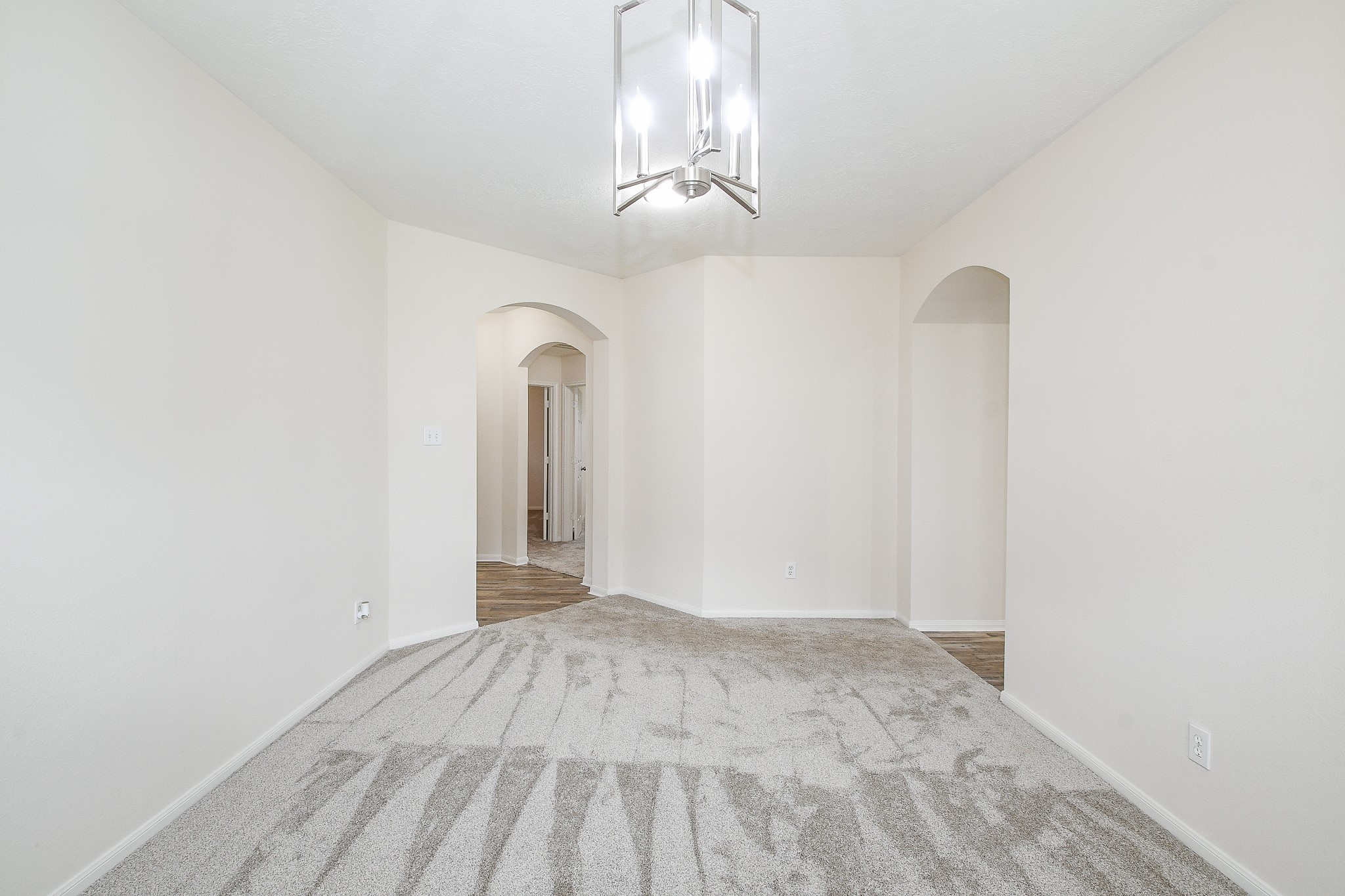 9203 Windy Spring Court Houston, TX 77089 - Photo 6 of 33 a view of a livingroom with a chandelier